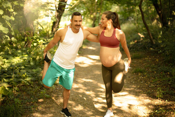 Happy couple exercising outdoors.