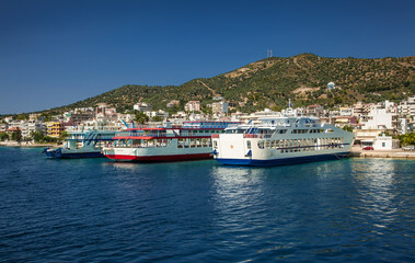 Fototapeta na wymiar Ferryboats on the dock in Lutra Edipsou (Aidipsos), Evia , Greece.