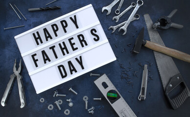 Happy Father&acute;s Day background with Various tools on a dark blue background, Top view.