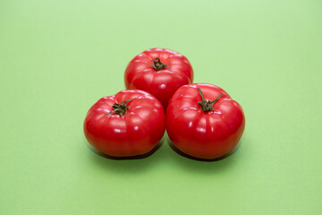 tomatoes on a green background