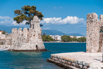 Fototapeta premium Historic buildings in the sea at Naupact, Greece