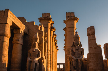 Amazing sunset view of columns and statues at Luxor Temple in Luxor, Egypt