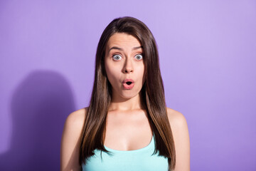 Photo portrait of amazed girl staring with opened mouth wearing teal singlet isolated on pastel violet color background