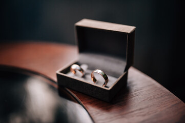 Wedding rings of brides in a box on the table