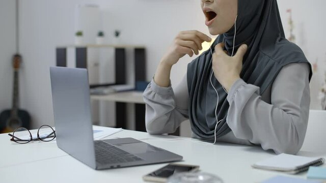 Muslim female tutor teaching students online by video chat, distance education