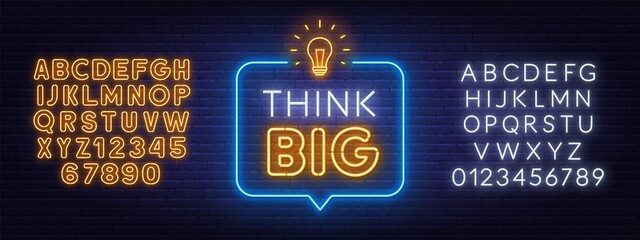 Think Big neon sign on brick wall background.