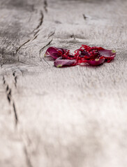 Poppy petals on a wooden board