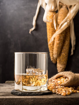 A Glass Of Classic Corn Whiskey (bourbon) On A Wooden Table. Vertical Photo.