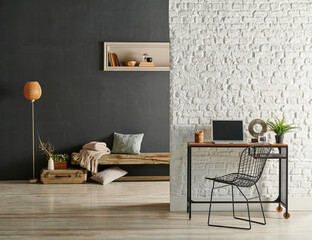 Modern room working table and chair with computer close up style, grey stone wall background with niche and wooden decorative bench.