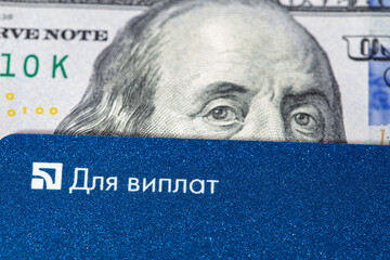 Debit card and US 100 dollar banknote