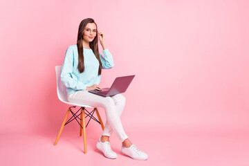 Full body portrait of pretty positive person arm touch eyewear use laptop isolated on pink color background