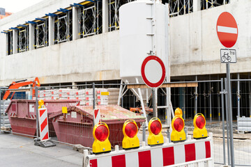 Construction site of a building with two floors of a concrete building with windows. There are...