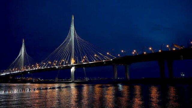 Saint Petersburg, Russia, April-10 2021: ZSD bridge with illumination across the Neva River in St. Petersburg at night.