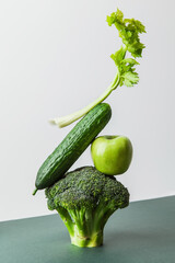 Fresh green vegetables on on the table. Equilibrium floating food balance. Food creative concept, levitation - 427888226