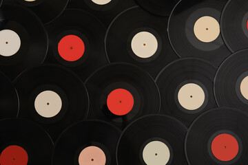 Vintage vinyl records as background, top view