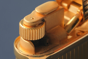 Macro shot of a lighter, parts devices, wheels for extracting sparks and holes in places of fire. Close-up. View from above. High quality photo