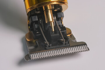 Fragment. Electric hair clipper close-up on a white background. High quality photo