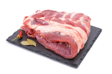 Raw pork ribs are isolated on a white background.
