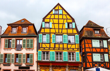Fototapeta na wymiar Old traditional colorful half-timbered houses in Colmar, Alsace region, France. Colmar's architectural landmarks reflect centuries of Germanic and French architecture and building materials