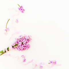 Bouquet of hyacinth flowers, petals with tapes on white background. Flat lay