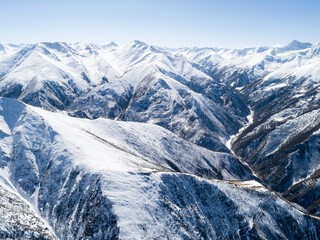 Aerial view of snow covered high altitude mountains in tibet China