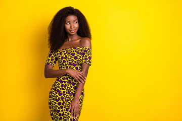 Portrait of attractive minded girl wearing smart elegant dress thinking copy space ad isolated over bright yellow color background