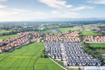 Fototapeta na wymiar Land or landscape of green field in aerial view. Include agriculture farm, house building, village. That real estate or property. Plot of land to housing subdivision, development, sale or investment.
