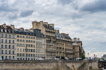Apartment buildings with Haussmann architecture along banks of the Seine river