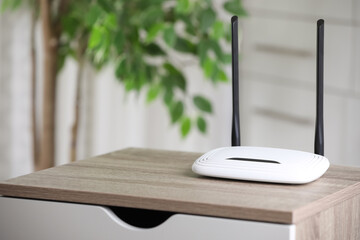 Modern Wi-Fi router indoors. Space for text - obrazy, fototapety, plakaty
