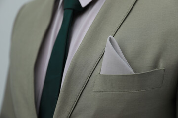 Man with handkerchief in suit pocket, closeup view