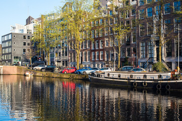 Naklejka premium beautiful canal houses and bridges in Amsterdam