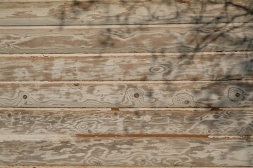 Naklejka premium Closeup of bright planks wall of a country cottage