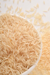 Pile of brown rice isolated on white background.