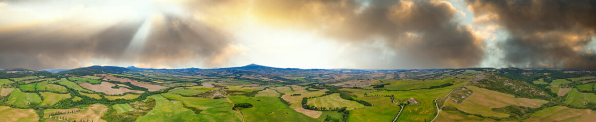 Fototapeta na wymiar Aerial view of Tuscany Hills in spring season from drone at sunset