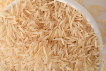 Pile of brown rice isolated on white background.