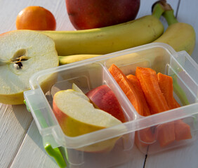 Lunch box with vegetables and fruits. Healthy food concept. Top view