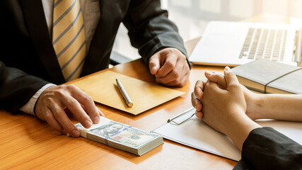 A good boss encourages and gives money to employees after completing the project, an Asian...