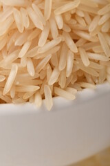 Pile of brown rice isolated on white background.