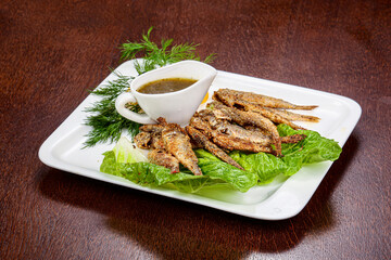 Fried barabulka fish with sauce