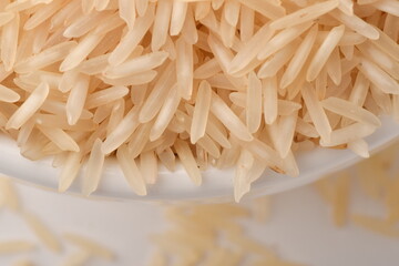 Pile of brown rice isolated on white background.