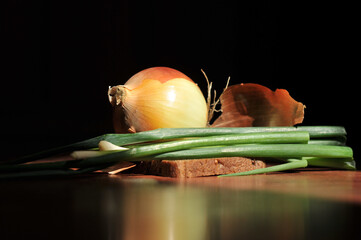 beautiful still life with onions and bread in the sunlight. Food background