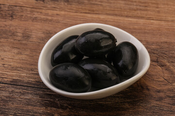 Pickled black olives in the bowl