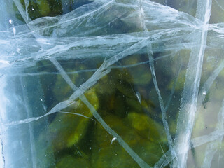 Through the transparent ice, you can see the bottom of Lake Baikal. Siberia Russia
