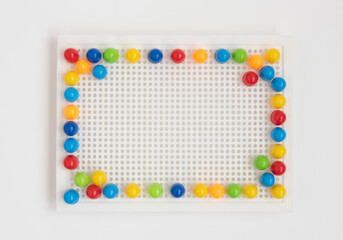 Fototapeta premium Baby kids toys mosaic frame on white background. Top view, flat lay. Copy space for text