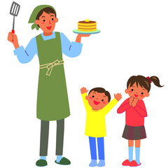 パンケーキを焼く父親と喜ぶ子どもたち