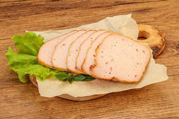 Boiled pork sausage over board
