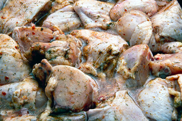 Sliced chicken, marinated in seasonings.