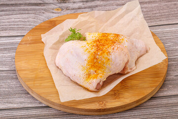 Raw chicken thigh with spices