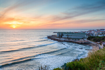 Fototapeta premium Viewpoint with panoramic landscape of the picturesque village of Ericeira at sunset. Close to Lisbon this fishing village is an amazing holiday destination for many tourists.