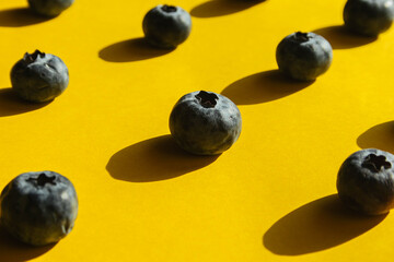 Flat lay composition with tasty blueberry on color background. Healthy food, raw food, breakfast.